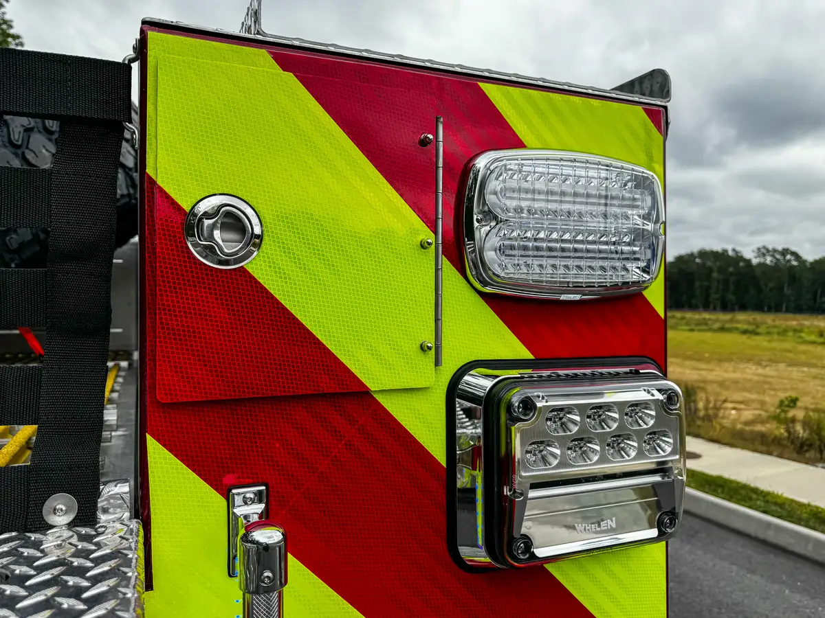 Top rear deck view along hosebed net and side rail edge.